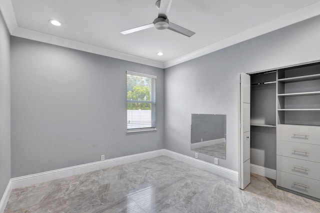 unfurnished bedroom featuring ceiling fan, crown molding, and a closet