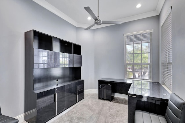 office area featuring ceiling fan and crown molding