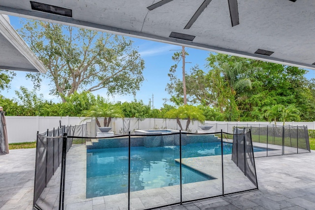 view of swimming pool featuring an in ground hot tub, ceiling fan, and a patio area