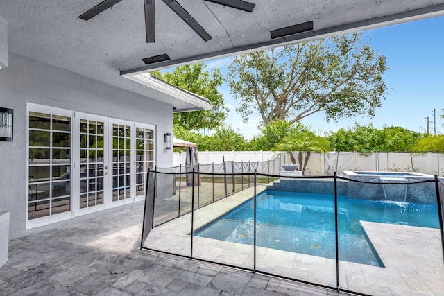 view of swimming pool featuring an in ground hot tub, french doors, ceiling fan, and a patio