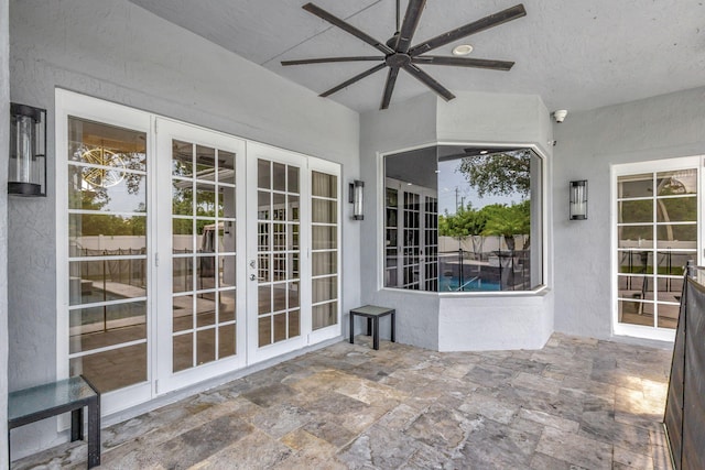 view of patio featuring ceiling fan and french doors