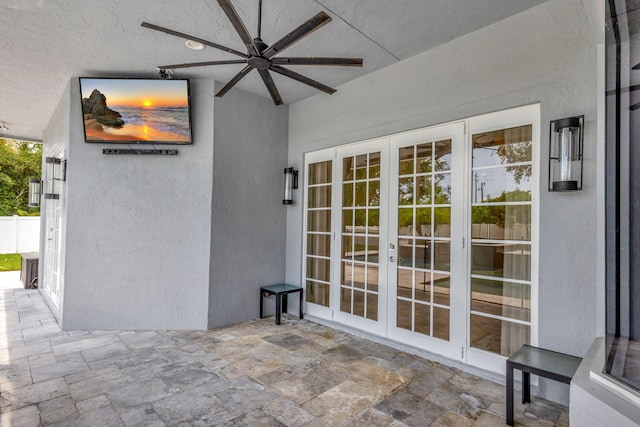 view of patio / terrace featuring ceiling fan and french doors