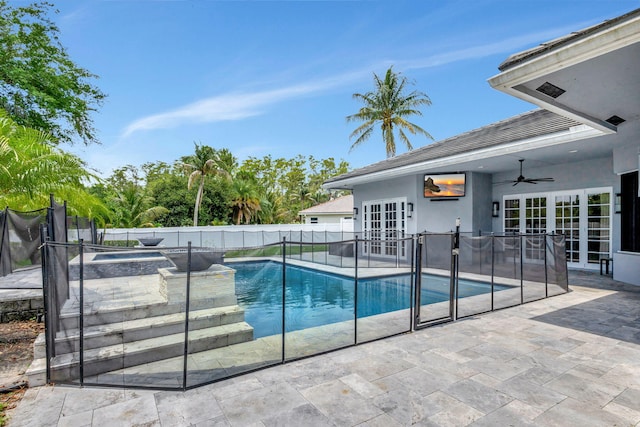 view of pool with a patio area, ceiling fan, and french doors