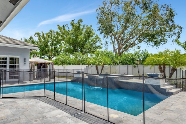 view of swimming pool featuring a gazebo, a patio area, and pool water feature