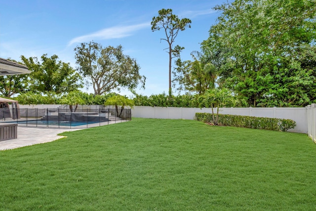 view of yard featuring a fenced in pool