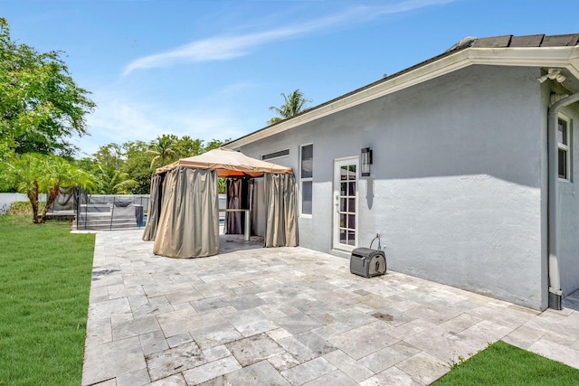 view of patio with a gazebo and a trampoline