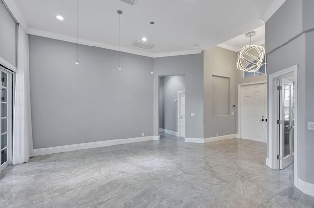 empty room with a towering ceiling and ornamental molding