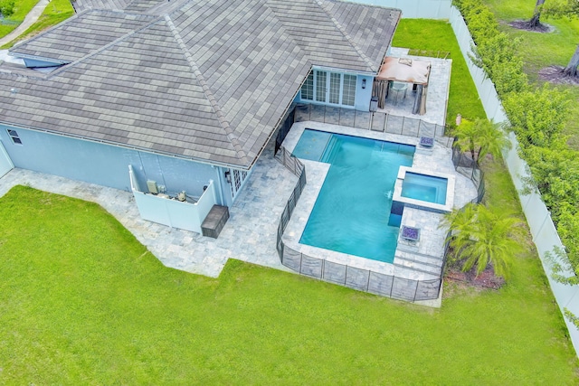 view of swimming pool with an in ground hot tub