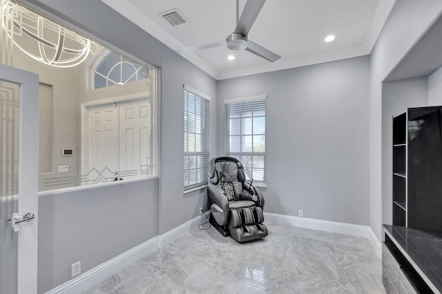 sitting room featuring ceiling fan and ornamental molding