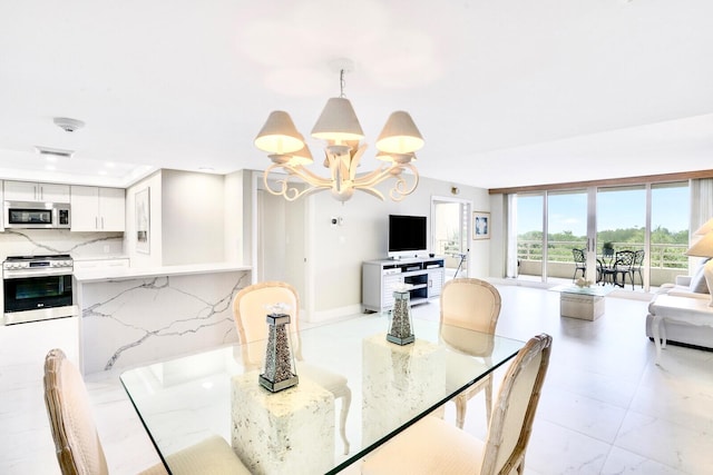 dining area featuring an inviting chandelier