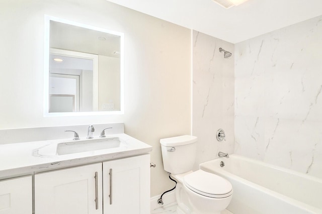 full bathroom featuring toilet, vanity, and tiled shower / bath