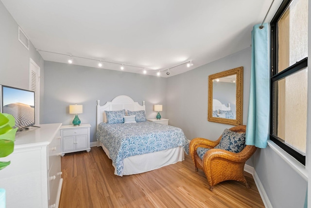 bedroom featuring wood-type flooring