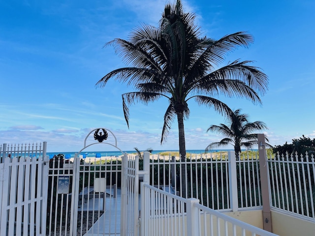 view of gate featuring a water view