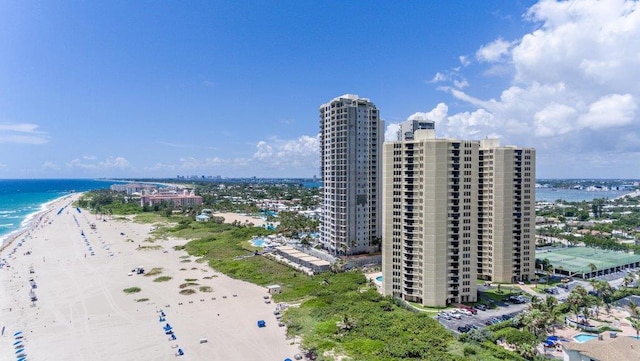 birds eye view of property featuring a water view and a view of the beach