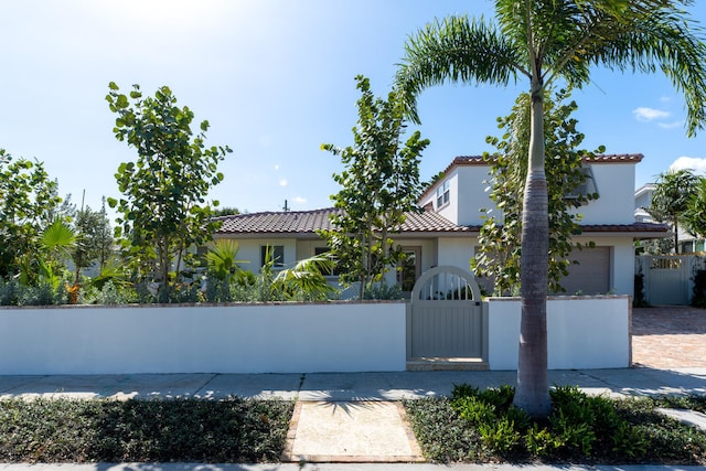 mediterranean / spanish-style home featuring a garage