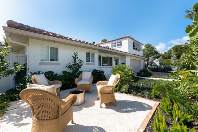 view of patio / terrace featuring a garage