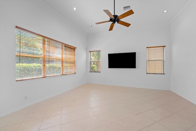 tiled empty room featuring ceiling fan and ornamental molding