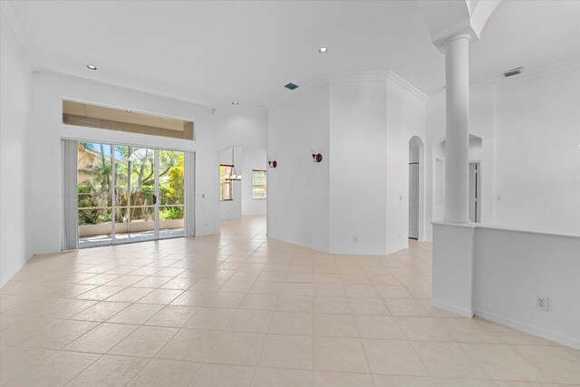 spare room with light tile patterned floors and ornamental molding