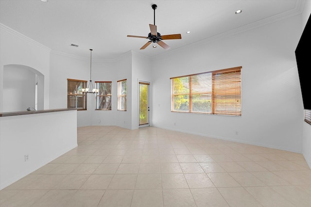 tiled empty room featuring ceiling fan with notable chandelier and ornamental molding