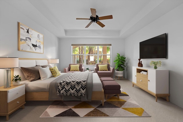 carpeted bedroom with a tray ceiling and ceiling fan