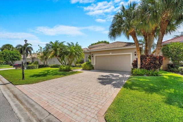 view of front of house with a front lawn and a garage