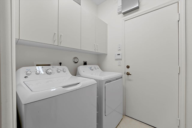 laundry area featuring cabinets and independent washer and dryer