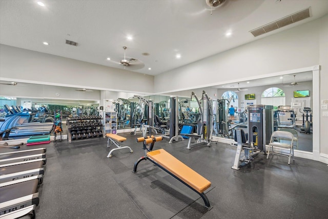 exercise room with ceiling fan