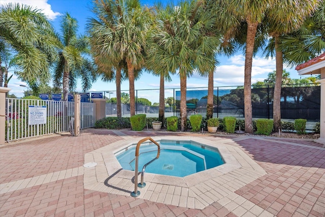 view of pool with a community hot tub and a patio