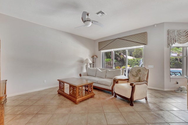 tiled living room featuring ceiling fan