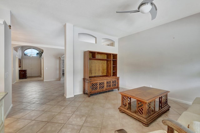 tiled living room featuring ceiling fan