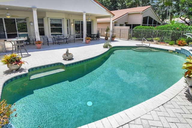 view of pool with ceiling fan and a patio area