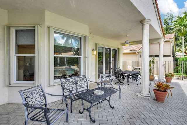 view of patio featuring ceiling fan