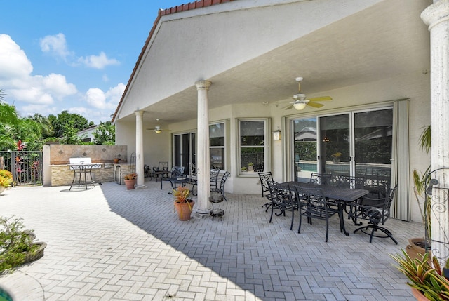 view of patio featuring ceiling fan