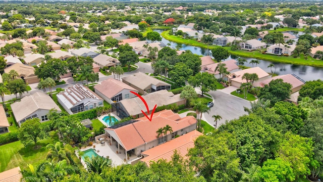 birds eye view of property featuring a water view