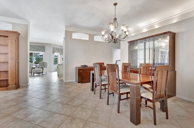 dining room with light tile patterned floors, ornamental molding, and an inviting chandelier