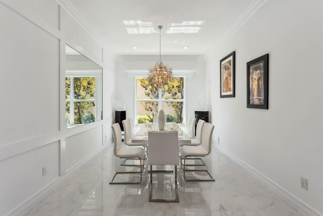 dining room with ornamental molding and a notable chandelier