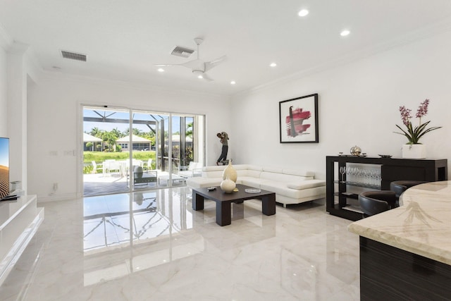 living room featuring ornamental molding and ceiling fan