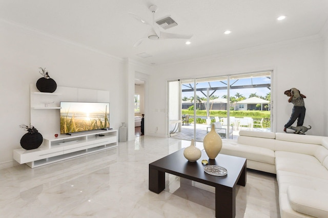 living room featuring ornamental molding and ceiling fan