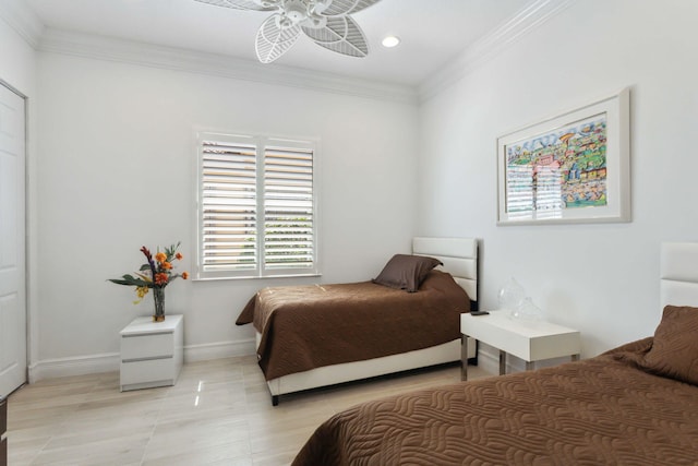 bedroom with ornamental molding and ceiling fan