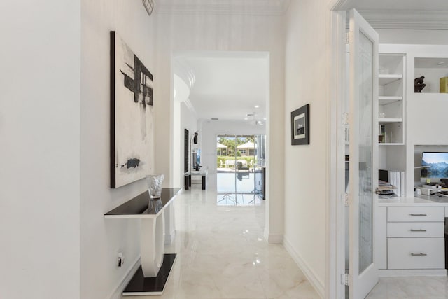 hallway with built in features and crown molding