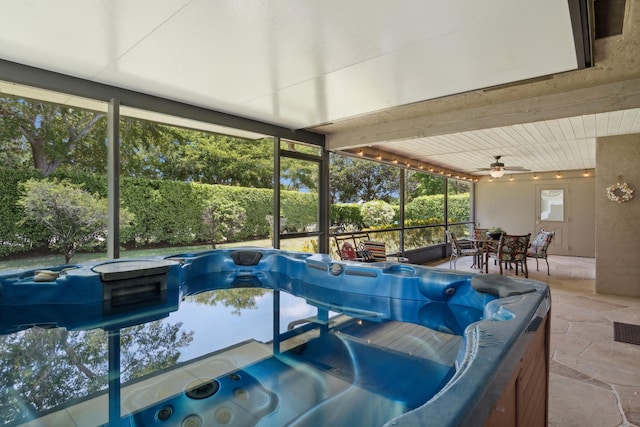 interior space with a jacuzzi and ceiling fan