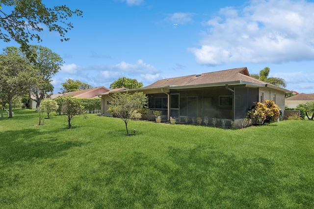 view of yard featuring a sunroom