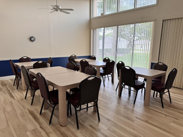 dining room featuring light wood-type flooring and ceiling fan