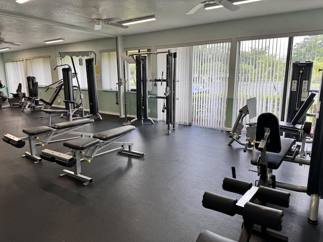 exercise room featuring ceiling fan and a textured ceiling