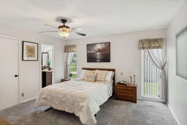 bedroom featuring carpet flooring, ensuite bathroom, and ceiling fan