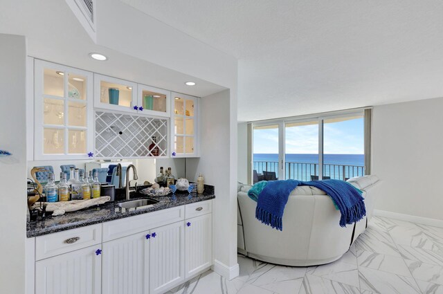 living room featuring floor to ceiling windows