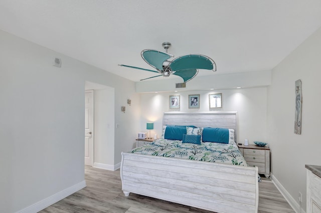 bedroom featuring light hardwood / wood-style floors and ceiling fan