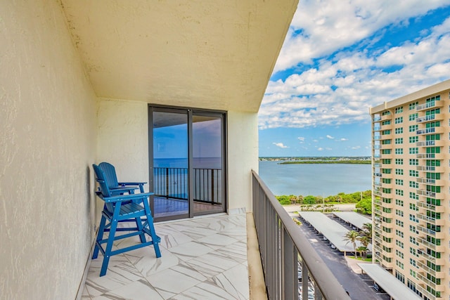 balcony featuring a water view