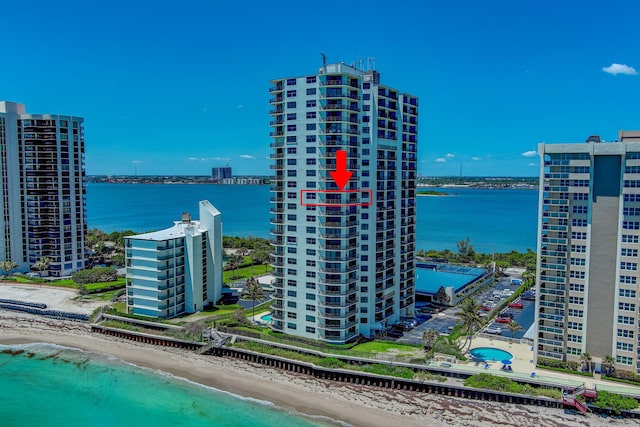 aerial view featuring a water view and a view of the beach