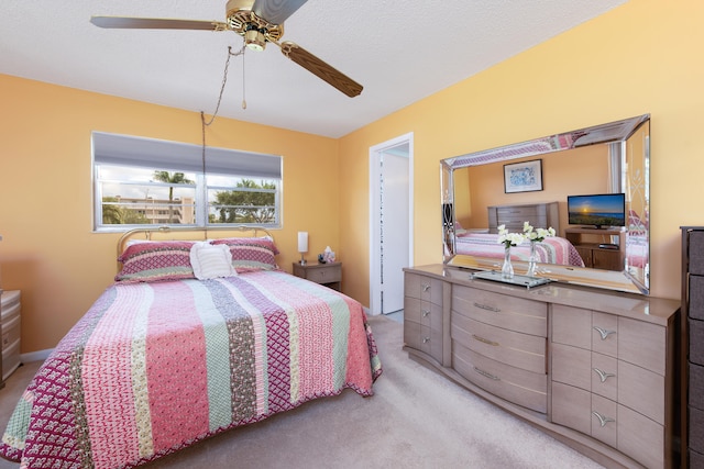 bedroom with ceiling fan and light colored carpet